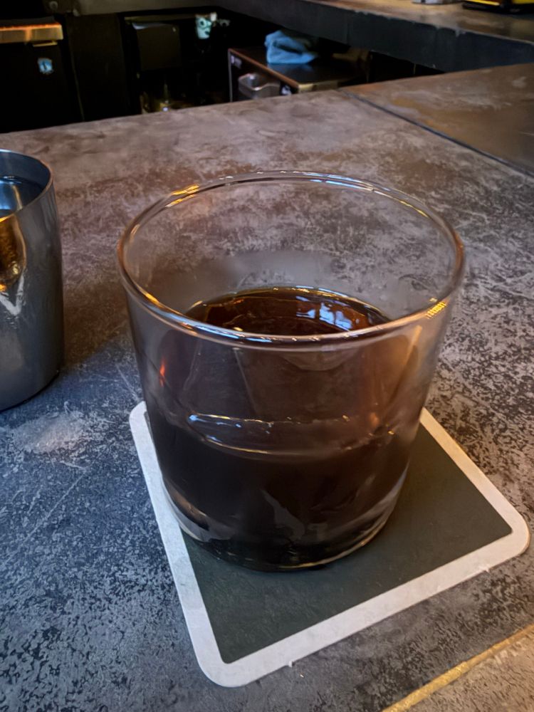 A forlorn cocktail on a nondescript bar in a nondescript town. 