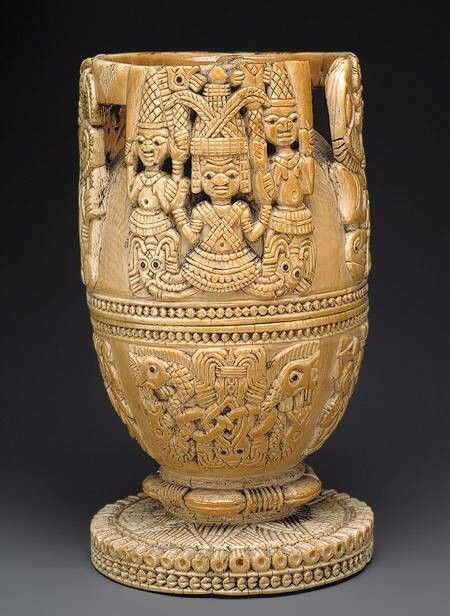 This spectacular ivory vessel was once the treasured possession of an olowo, the ruler of the Yoruba kingdom of Owo in present-day southern Nigeria.

IMAGE: Ivory chalice/cup with decorative images people carved around at the top (probably a ruler with subjects on either side of them), followed by 2 lines of decorative dots beneath, followed by a scene of some sort beneath that.