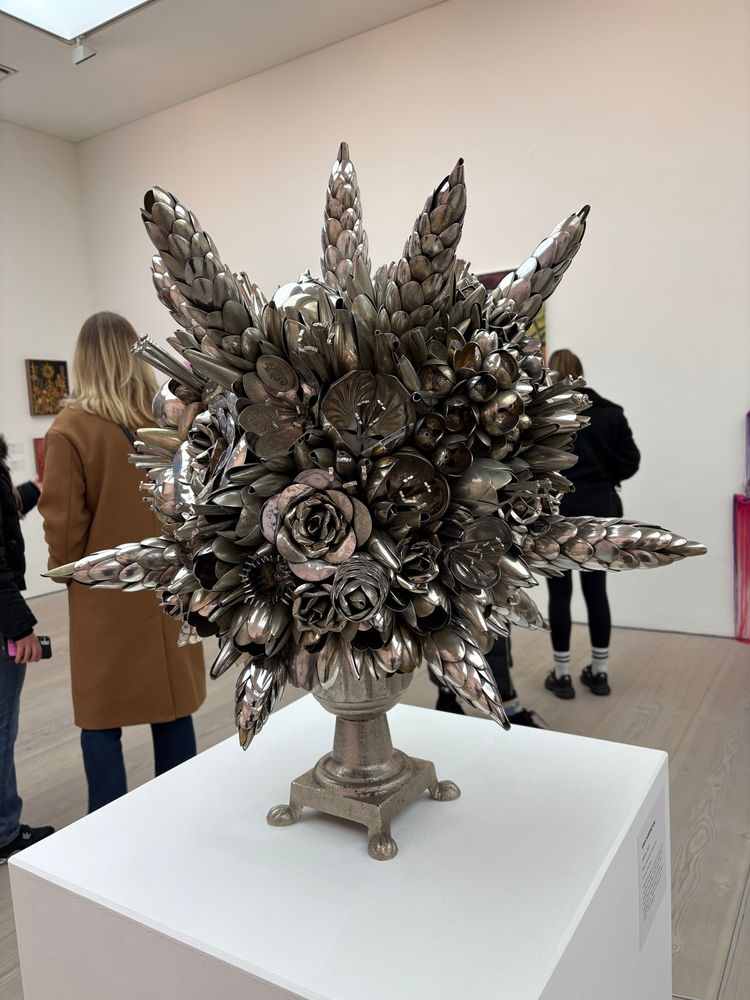 A bouquet of flowers sculpted out of cutlery 
