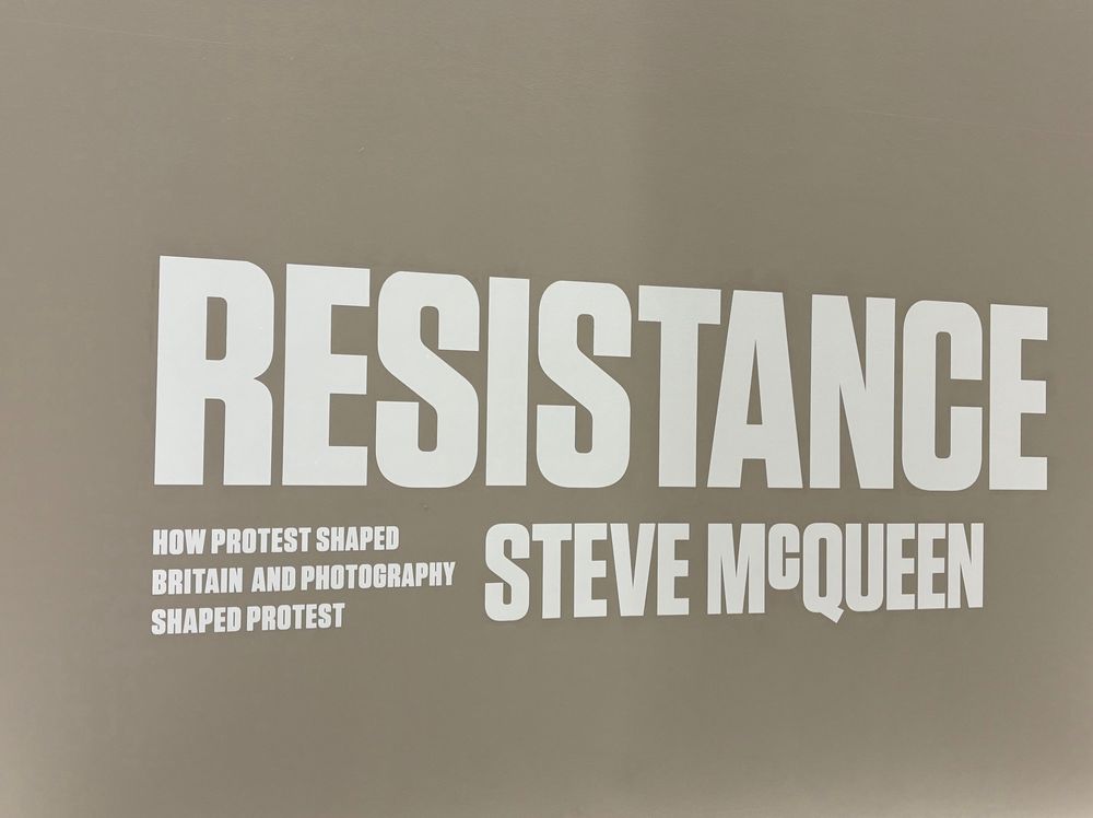 Sign saying

RESISTANGE
HOW PROTEST SHAPED BRITAIN AND PHOTOGRAPHY
SHAPED PROTEST
STEVE MCQUEEN