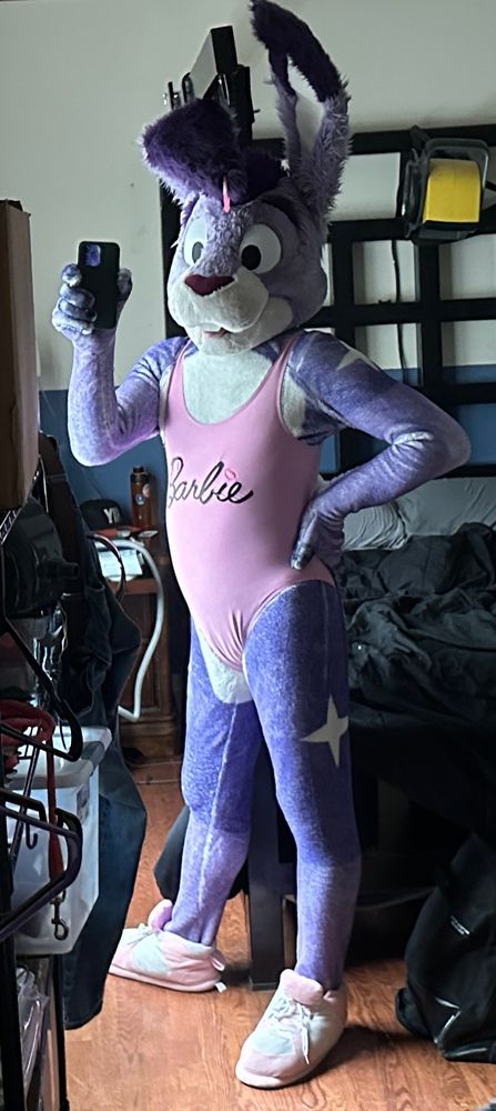 Twilight bunny in purple/white fur petsuit and pink Barbie swimsuit, taking a full body mirror selfie.
Paw on hip.
