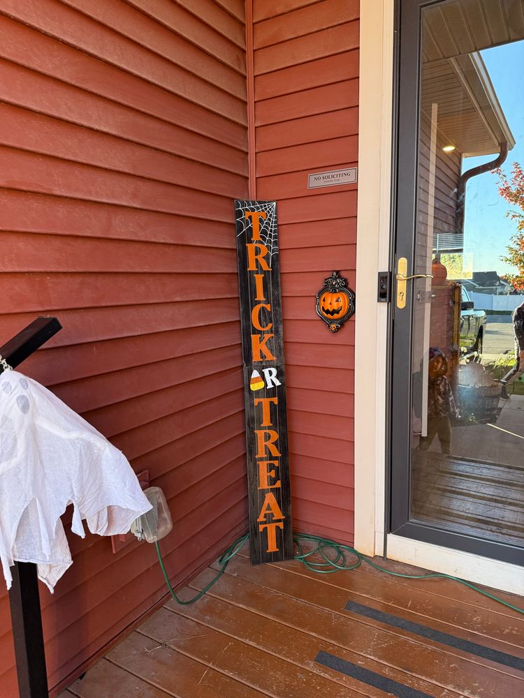 Halloween Decorations- a ghost cat on a pumpkin inflatable, a skeleton inflatable, spider and cat with pumpkin inflatables, rockin skeleton lights, a resin skeleton with purple lights, a ghost and witch post, a pumpkin doorbell and trick or treat sign 