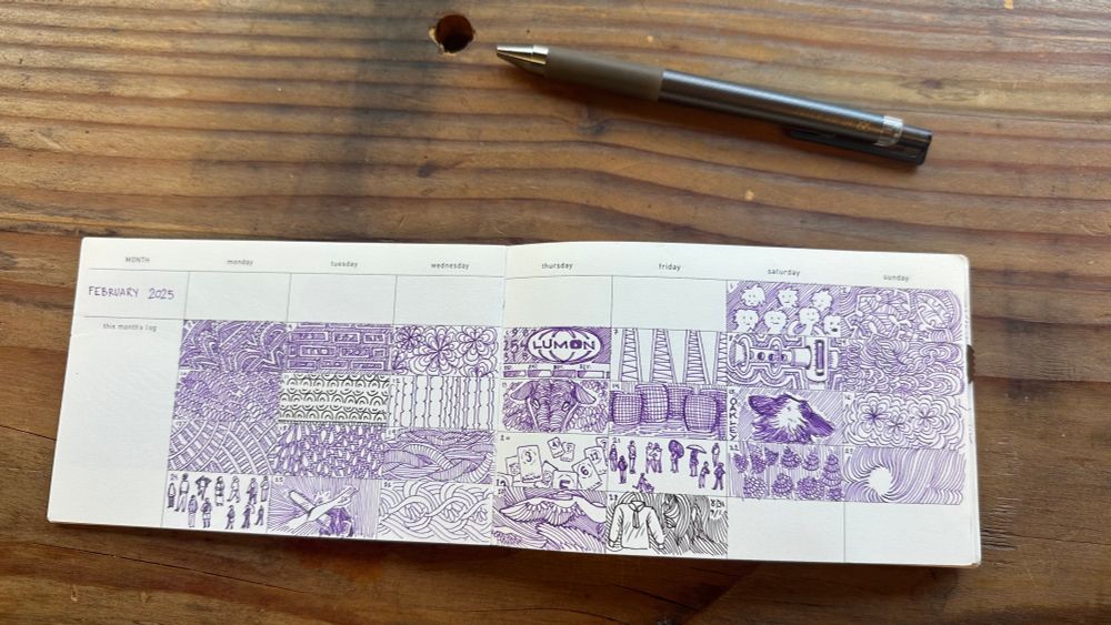 A book on a wooden counter, next to a pen. A horizontal page spread shows 5 rows and 8 columns (labeled MONTH, Monday, Tuesday, Wednesday, Thursday, Friday) 
The squares are hand-numbered with the days of the month. This spread is February 2025. Highlights include some miniature people drawings, a dog's head up close from behind, the Lumon logo from Severance, and many knots, lines, and hatches. Most of the drawings are in purple ink, with only a couple in warm black.