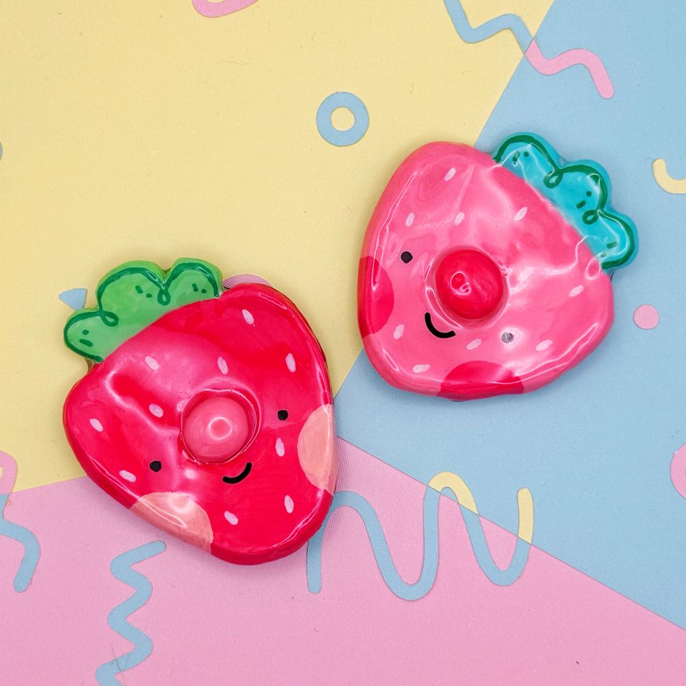 Photo contains two strawberry clay dishes 