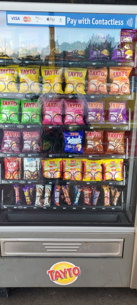 Large vending machine filled with about 12 different types of Tayto crisps 