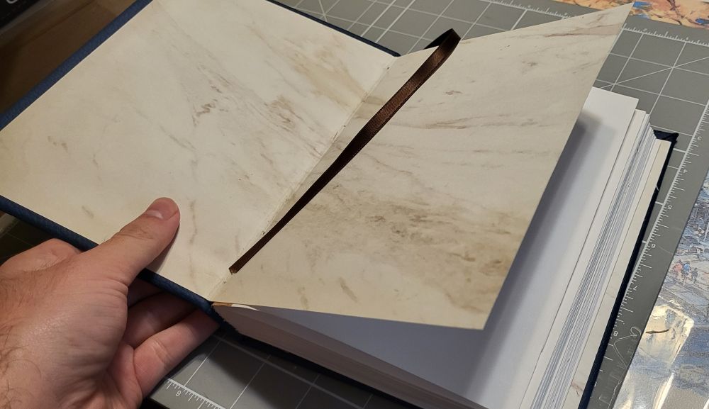 A handmade notebook (it's got a ribbon book mark built into the spine)