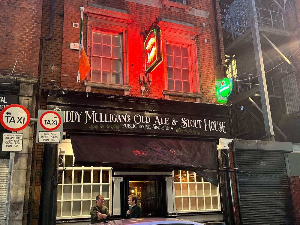 Exterior of Biddy Mulligan's Old Ale & Stout House, with Sackville Lounge neon still in place.