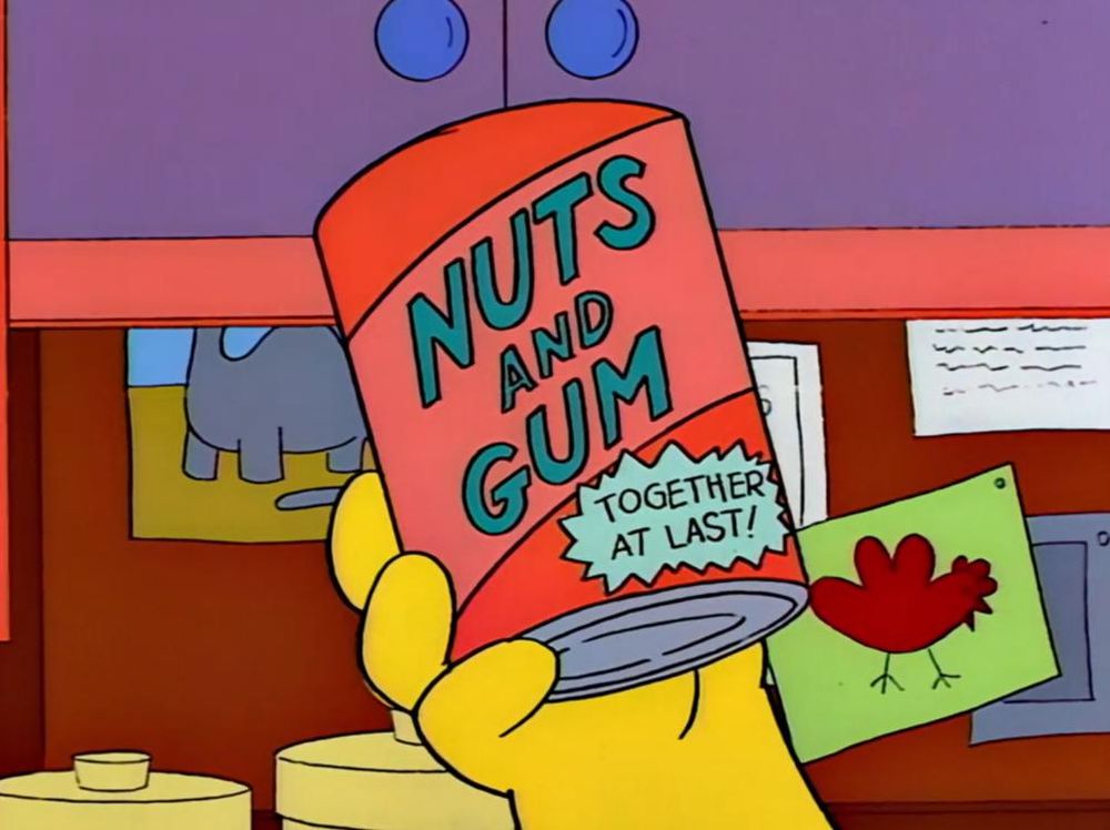 Frame from the Simpsons depicting a red can being held aloft. The can's label reads "Nuts and Gum: Together at last".