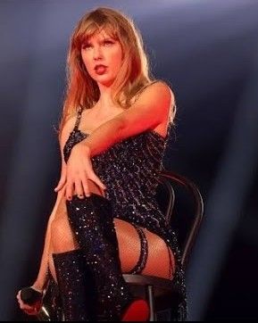 Taylor Swift at the end of her performance of Vigilante Shit at The Eras Tour sitting on a chair