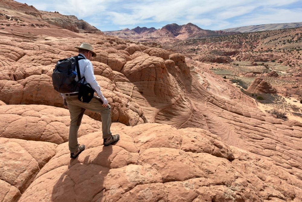 Tim standing on a nice example of polygonal weathering, looking over Buckskin Gulch