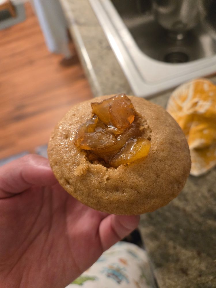 A gluten free dairy free brown sugar cupcake with apple jam in the center