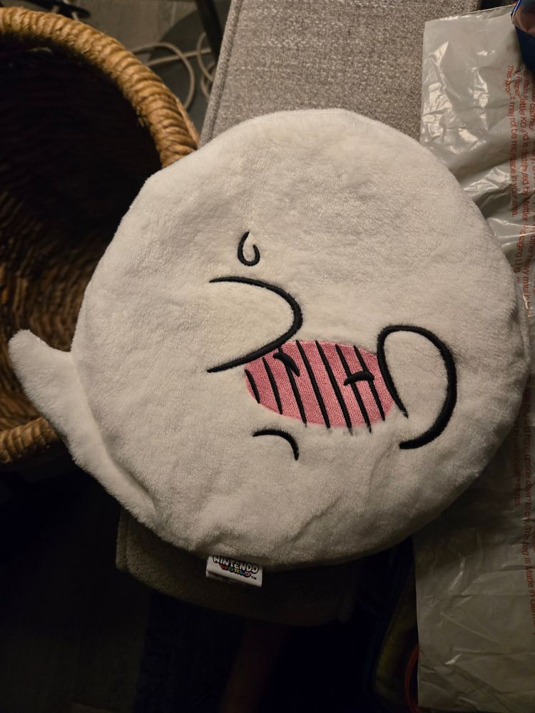 A beret of Boo from the Super Mario games with his hands held over his face with an embarrassed blushing expression