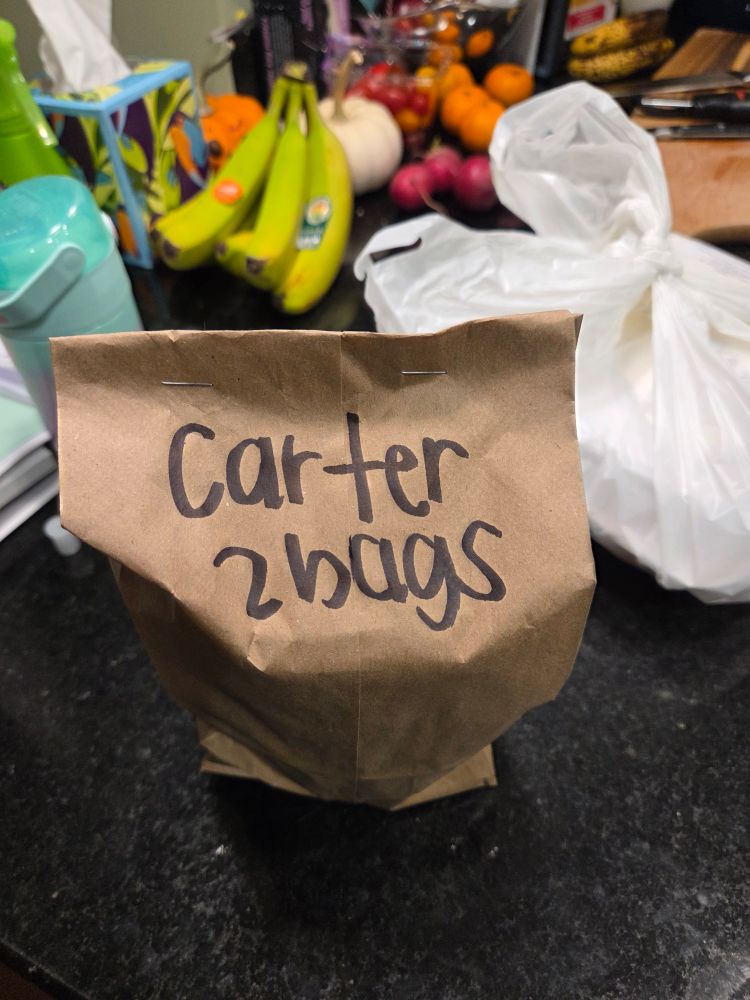 A to- go food bag labeled "Carter 2 bags"