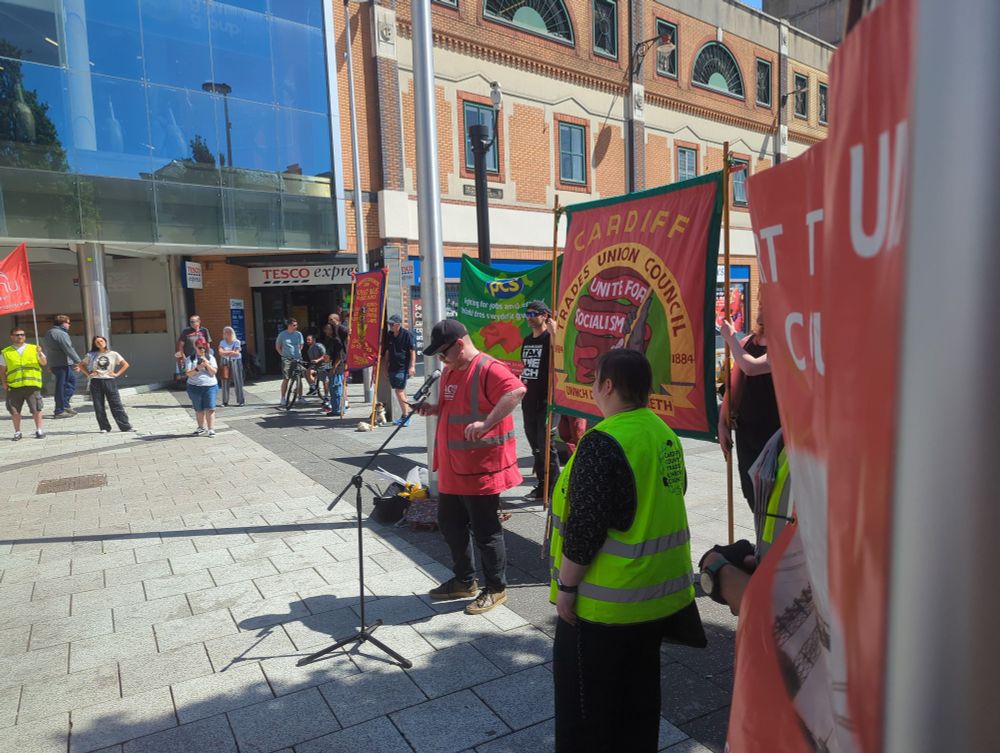 Dan of ACORN speaking to the parade in Cardiff 
