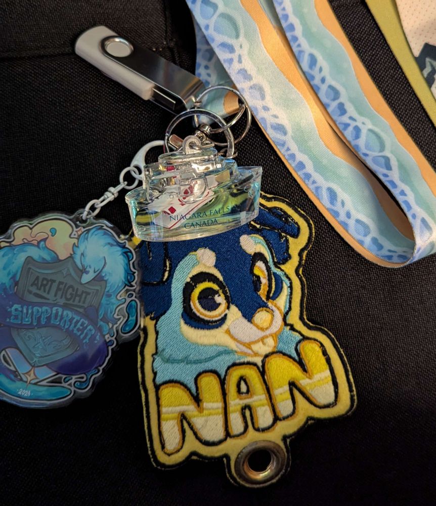 beach, ocean waves lanyard with Niagara Falls keychain, embroidered fursona badge for Nan, an ArtFight supporter acrylic charm