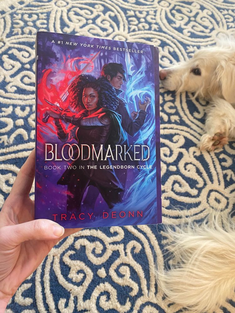 Bloodmarked by Tracy Deonn. Also there’s a dog. 