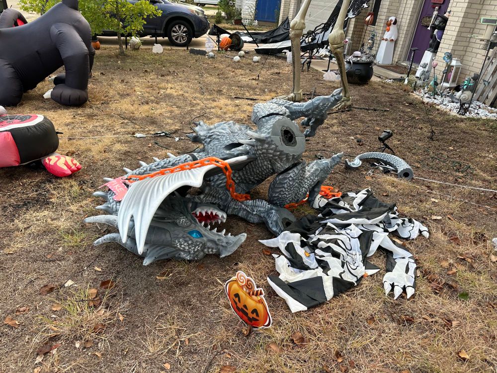 A pile of parts that used to be a big plastic dragon