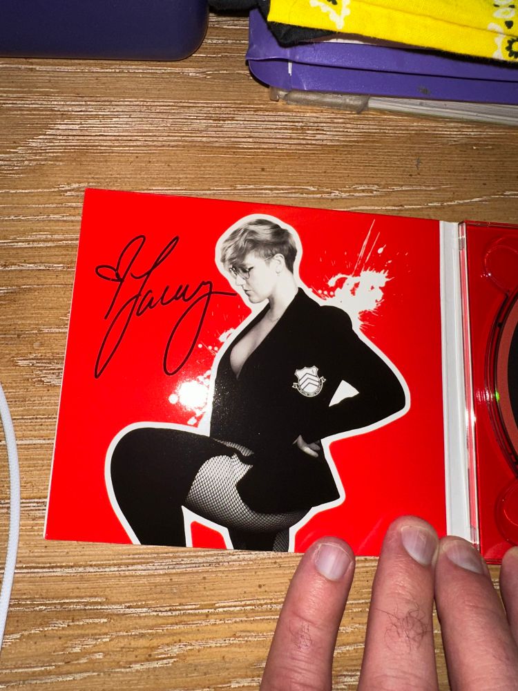 Lacey Johnson’s autograph in the CD case