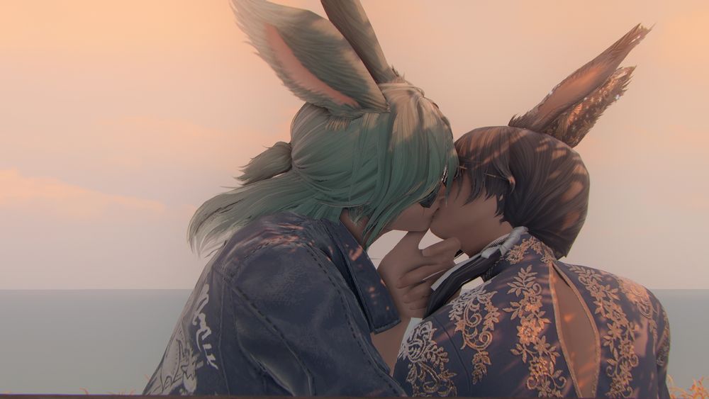 To viera men exchanging a kiss at sunset. 