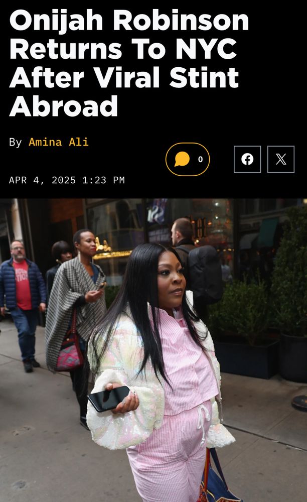 Headline: Onijah Robinson Returns To NYC
After Viral Stint Abroad
date: APR 4, 2025 1:23 PM
photo of Robinson in a pale pink two piece suit with white jacket walking on a New York City sidewalk