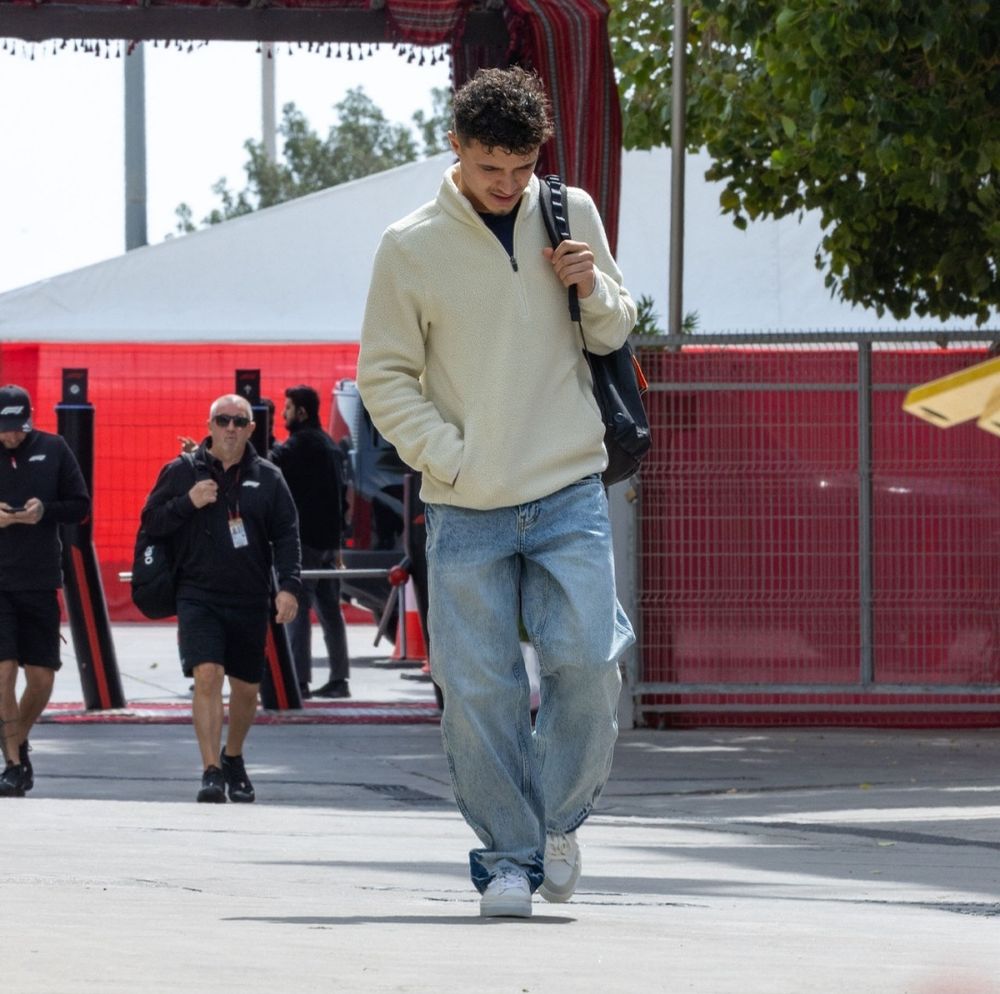 lando norris arriving at the paddock