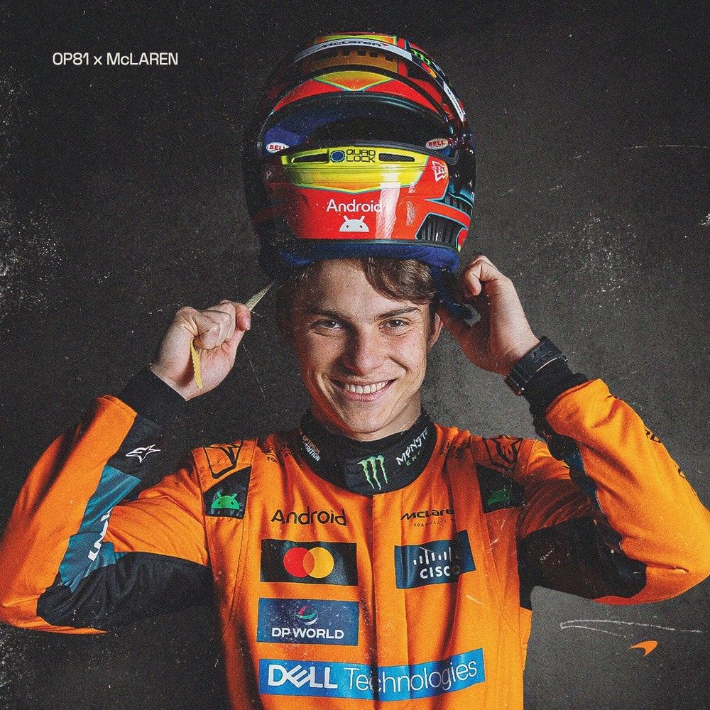 Oscar piastri in his race suit with his helmet