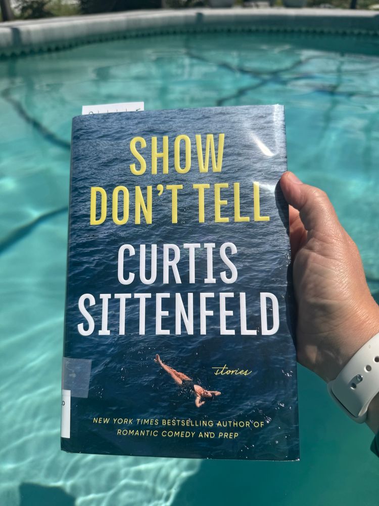 Copy of the book show don’t tell in a pool 
