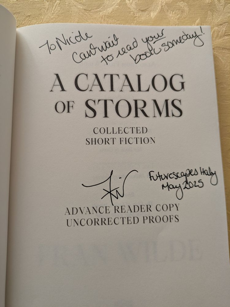 The inside cover of the book "A Catalog of Storms: Collected Short Fiction" is labeled "Advance Reader Copy: Uncorrected Proofs" and contains a signature from author Fran Wilde with the message "To Nicole: Can't wait to read your book someday! Futurescapes Italy May 2025"