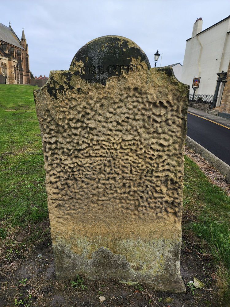 A weather worn gravestone