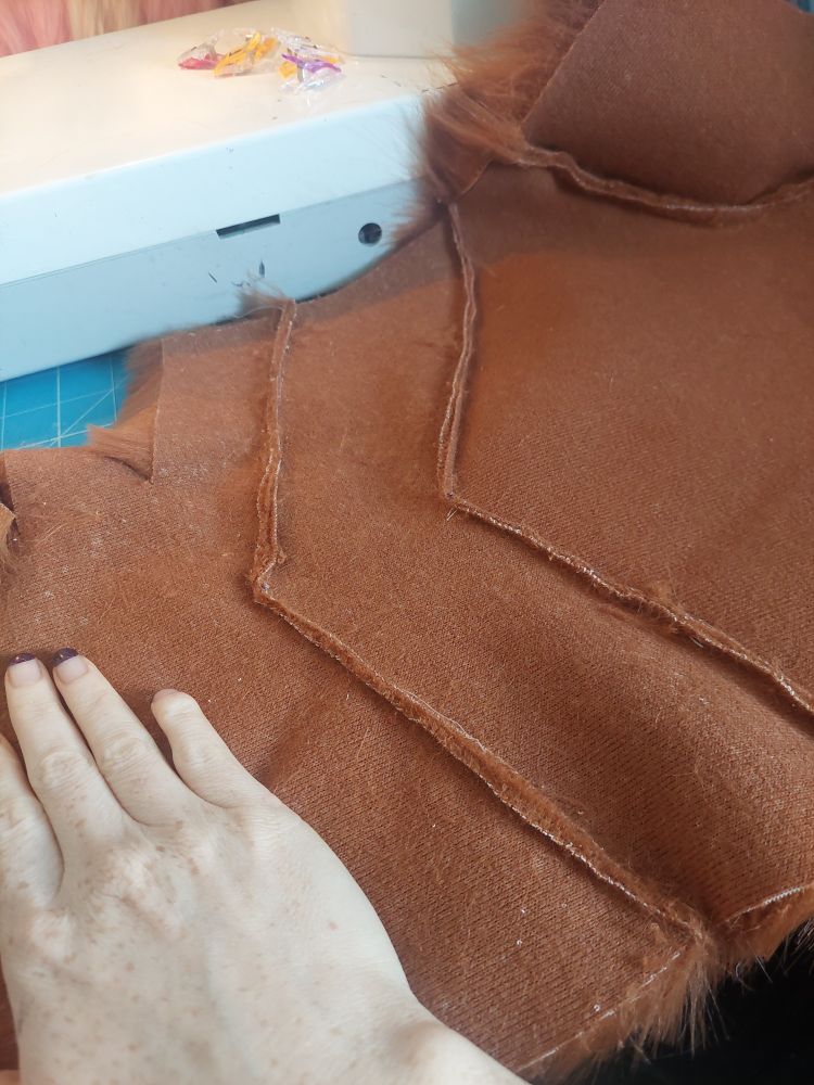 The backing of the fur pieces - there are three separate pieces of fur that have been sewn together, that aren't noticeable from the front.