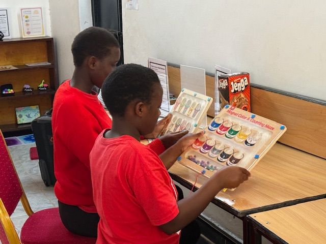 Students work on magnetic sorting puzzles. 