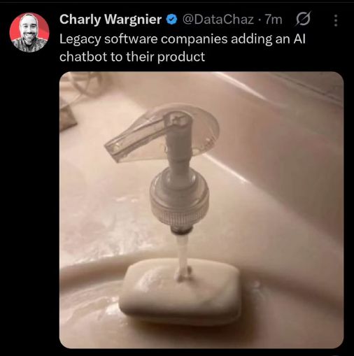 Screenshot of a post by Charly Wagnier @DataChaz. Shows a photograph of a soap dispensing pump and nozzle stuck into a bar of soap. Caption reads: Legacy software companies adding an AI chatbot to their product.