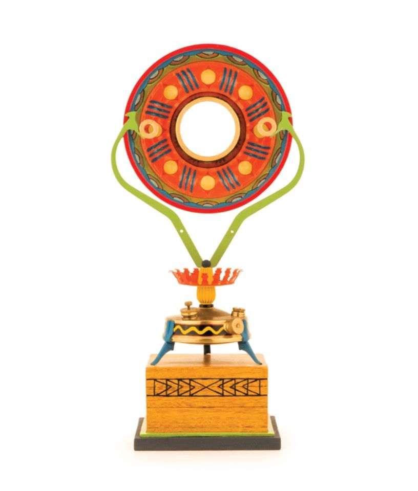 Photograph of an assemblage sculpture by Charlayn von Solms incorporating amongst other objects, a Burmos camping stove.