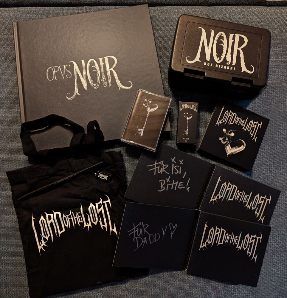 photo of earbook, cassette, bento box, pencil, bag, usb, cds with dedications 