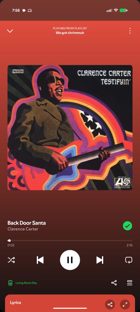 A screenshot of Spotify, showing Back Door Santa by Clarence Carter playing 