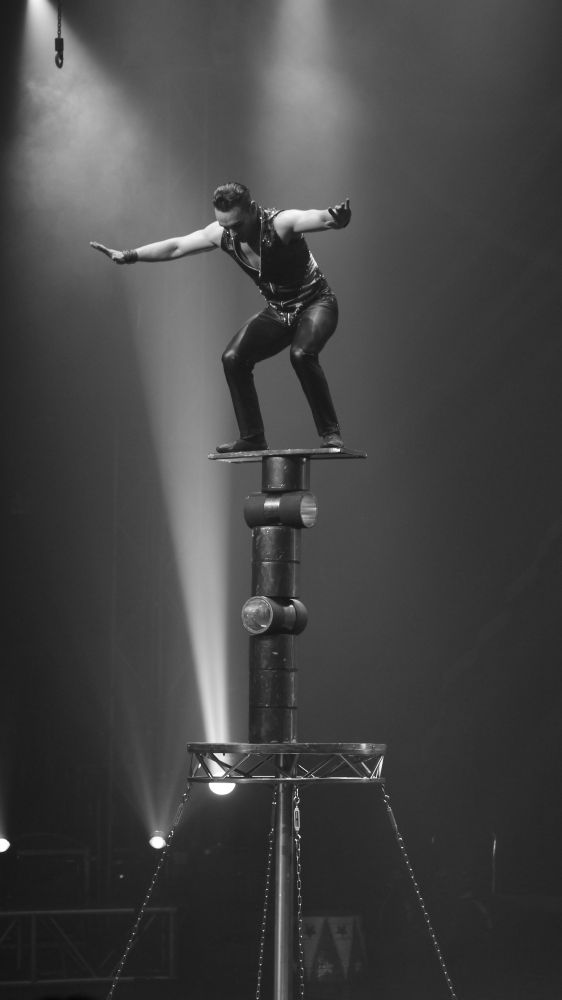 Man balancing act in a circus 