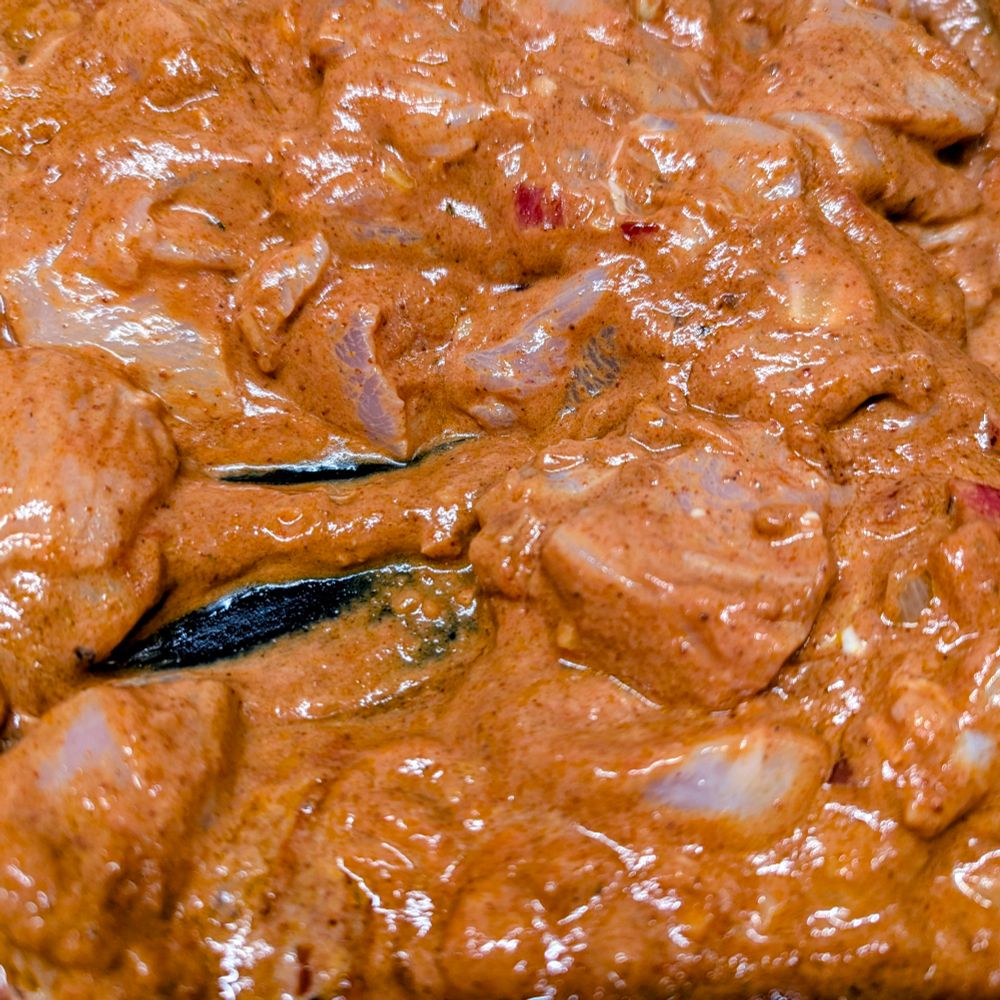 Chicken marinading in advance of becoming a Tikka Masala.