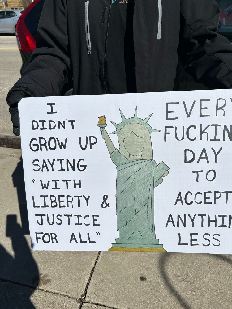There were some great signs there today. This one says "I didn't grow up saying 'with liberty and justice for all' every fucking day to accept anything less"