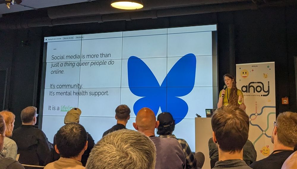 Slide: social media is more than Just a Thing queer people do online. It's community. it's mental health support. It's a lifeline.