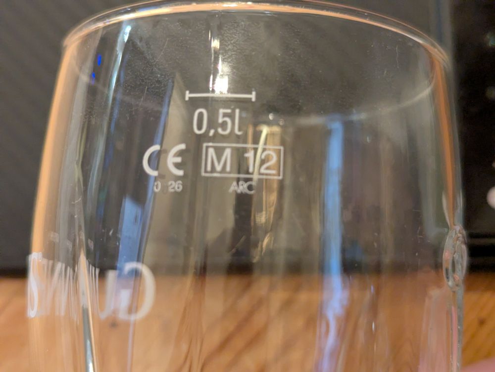 A half litre Guinness glass that shows the half litre measurement below the rim of the glass allowing space for a decent head on your pint of Guinness.