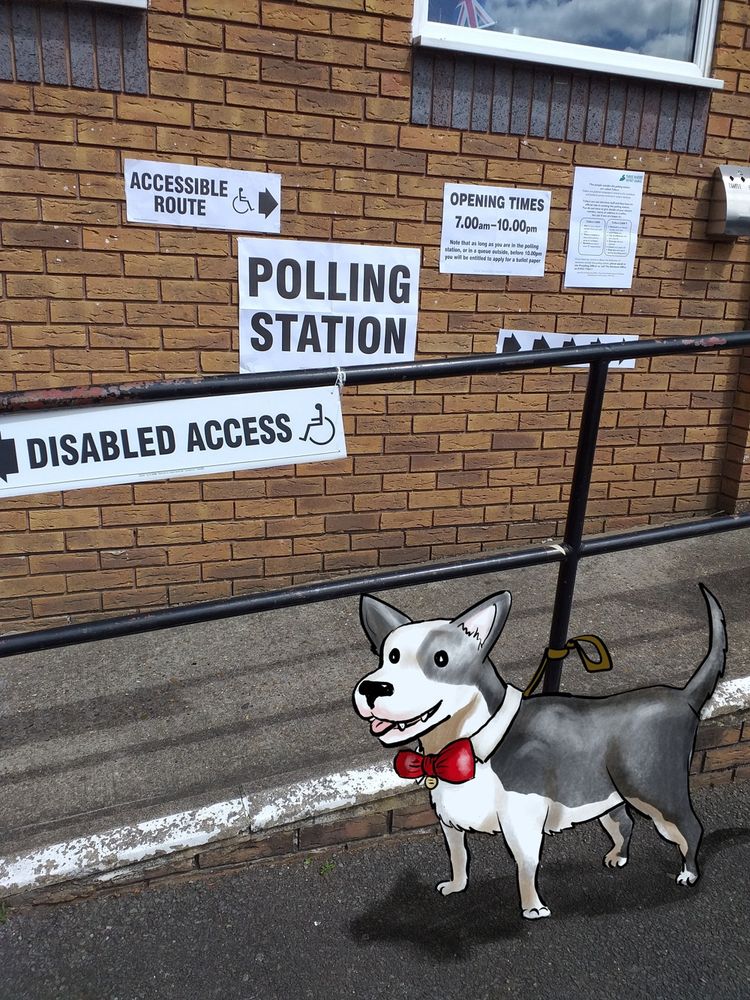 A cartoon of a small black and white dog wearing a red bow tie at a polling station. British General Election 2024