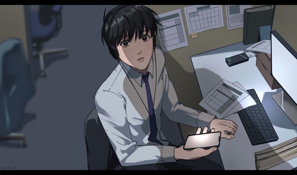 Kim Dokja looking up from his cubicle at Mino Soft as a shadow falls over him. Following the description in the webnovel, he is wearing headphones and has a portable battery charging in the corner of the cubicle. He is holding his phone in his right hand and has a bewildered expression on his face.