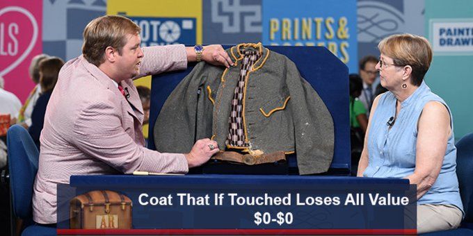 Man on Antiques Roadshow physically examining a coat, with a caption underneath reading:
"Coat That If Touched Loses All Value"
"$0-$0"