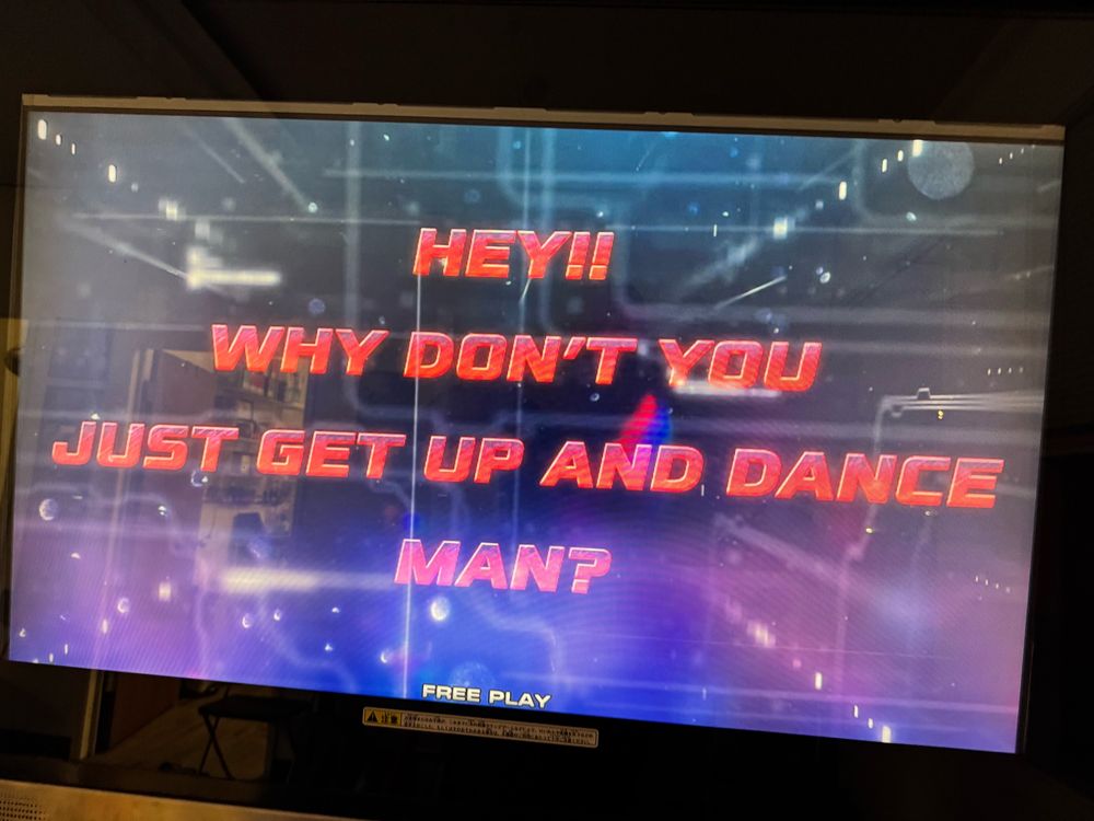 Picture of a pump it up XX fail screen with the text “Hey! Why don’t you just get up and dance, man?” from a slightly different angle
