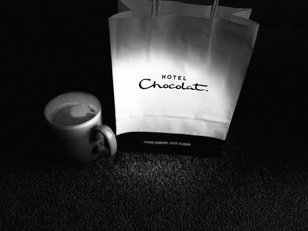 A coffee cup and a mysterious Hotel Chocolat bag! 
