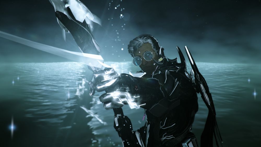 Amir Beckett in an all black outfit, posed with the nataruk aimed at the camera. his shades have been colored blue!! 