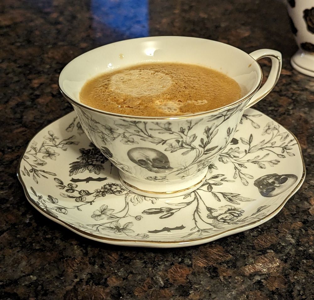 White Teacup with coffee inside