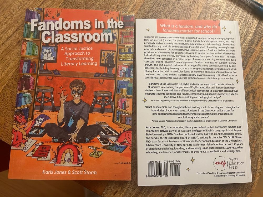 The front and back covers of a new book "Fandoms int eh Classroom" by Karis Jones and Scott Storm. Front cover image shows a girl sitting cross-legged on the floor in a classroom. She if framed by large wooden bookcases and is surrounded by books, comics, computers, and a digital tablet as well as a jovial cartoon dragon whose body is magically popping in and out of the floor. The classroom floor and wall are bright orange and the cover art invites wonder and whimsy in a rich intellectual environment