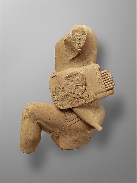 Limestone figure of kneeling Herakles (late 6th or early 5th century BCE) by unknown.
