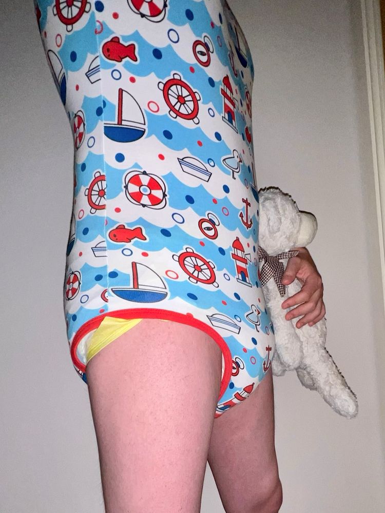 Me stood in my Hello Sailor onesie and soggy Animooz nappy, holding Teddy